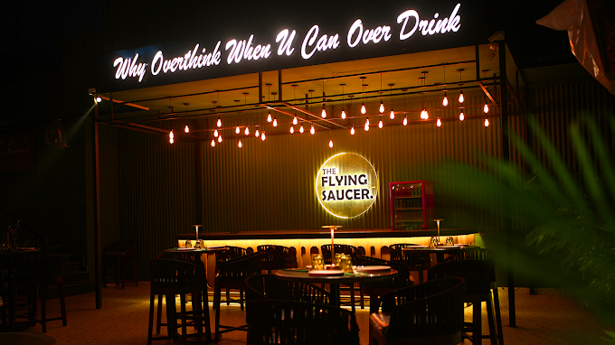 “Cocktail glass with live music stage at Flying Saucer Jhansi